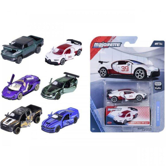 Collection of toy cars including a Majorette packaging with a white car.