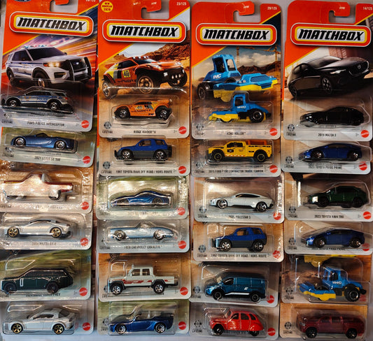 Collection of Matchbox toy cars in their packaging on a white background