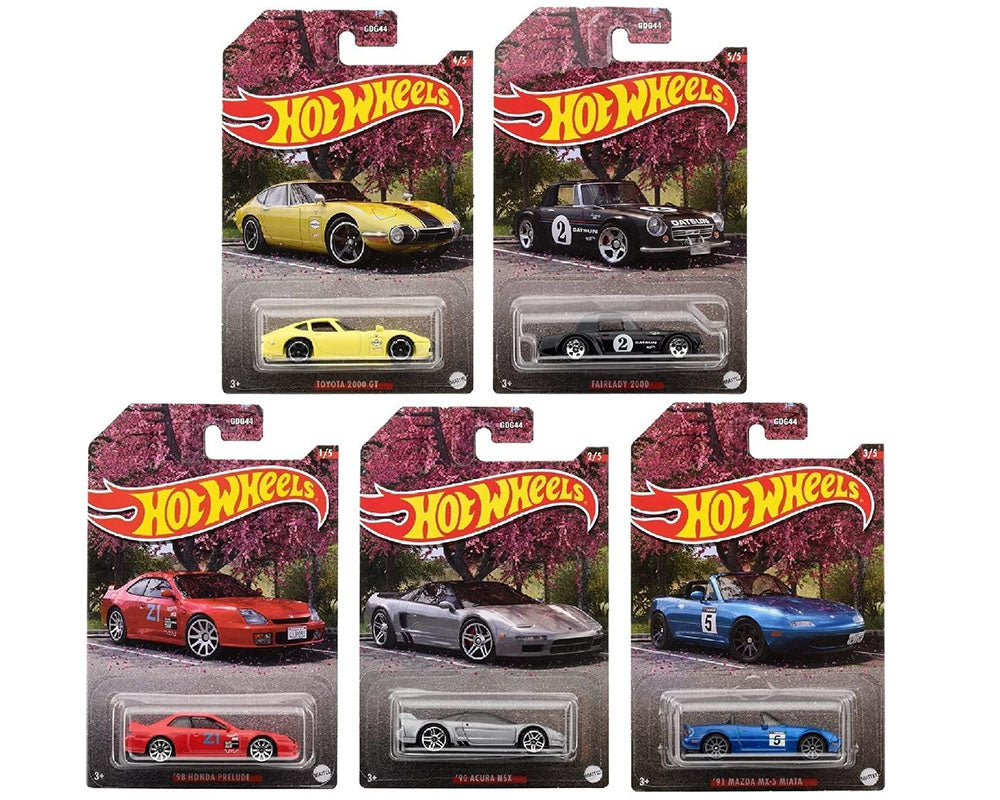 Five Hot Wheels 1:64 Walmart Exclusive Theme JDM cars—yellow Toyota 2000 GT, black Nissan Silvia, red and silver Nissan 300ZX, blue Mazda RX-7—are displayed in original packaging.