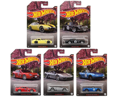 Five Hot Wheels 1:64 Walmart Exclusive Theme JDM cars—yellow Toyota 2000 GT, black Nissan Silvia, red and silver Nissan 300ZX, blue Mazda RX-7—are displayed in original packaging.