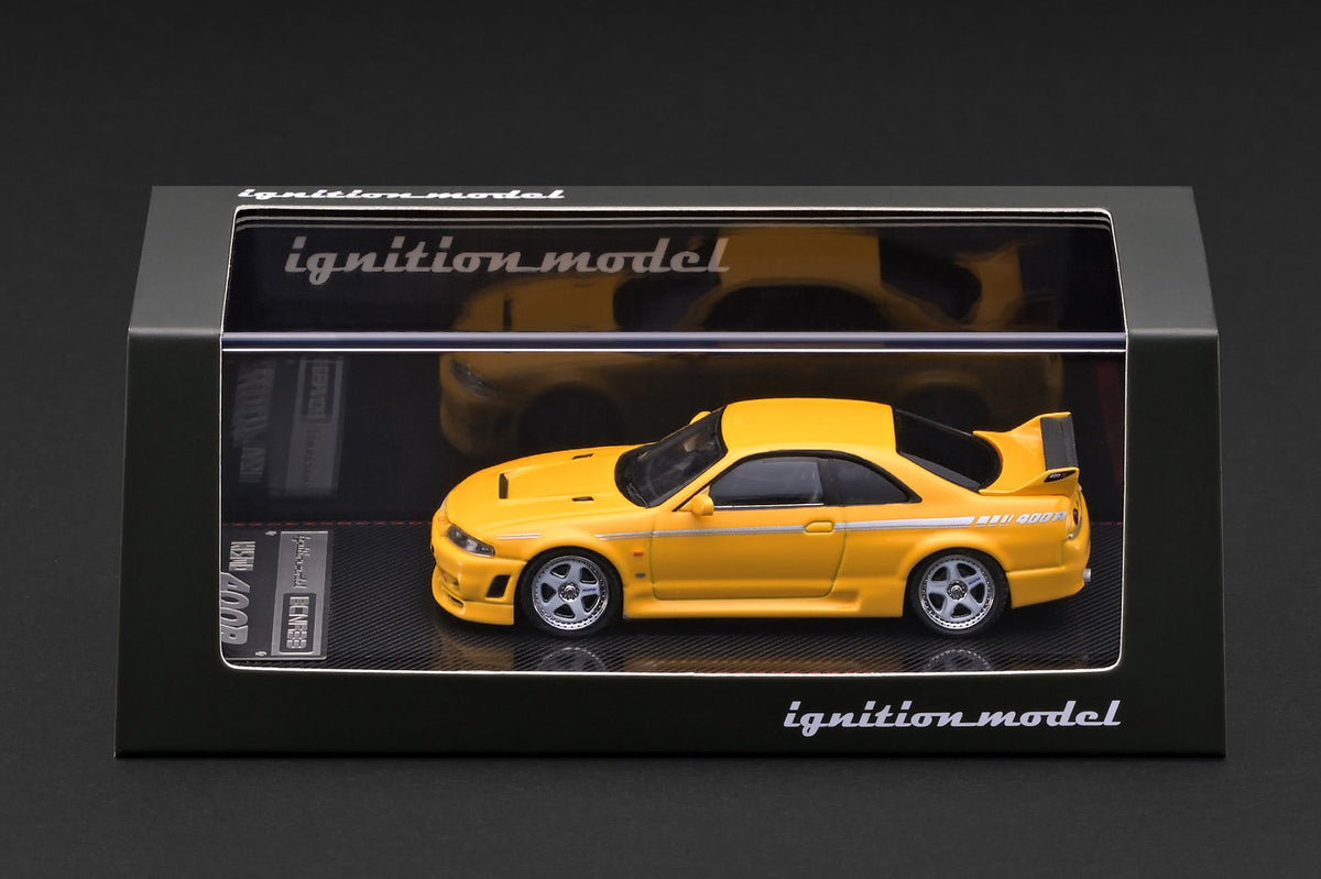 Ignition Model 1:64 Nissan NISMO 400R (BCNR33) Yellow – IG4272 – model with display case