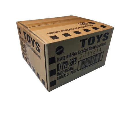 Cardboard box labeled 'TOYS' on a white surface with a brick wall background