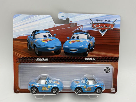 The Disney Cars 3 Character Car Vehicle 2-Pack 2022 Mix 4 by Cars Movie features Dinoco Mia and Dinoco Tia cars in blue with number 95 and Dinoco logos, packaged in a blister pack with illustrated backing art.
